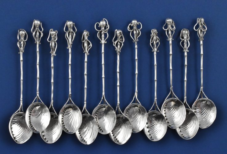 A set of 12 Japanese Sterling silver tea spoons having octopi finials with gold inlaid eyes, bamboo-style handles and cast abalone shell bowls by Sadajiro (of) Musashiya. Import marks for London 1893 & 1894 by Liberty & Co.