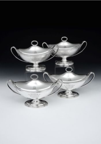 A fine set of four George III boat-shaped Sauce Tureens, with reeded bases, leaf-capped strap handles, reeded finials to covers, engraved on each body and cover with the crest and armorials for Sir John Barrington, 9th Baronet of Barrington Hall, Essex. Each measuring 9.4” (24cm) over handles, weight of set 89.2oz, (2775g). Hallmarked London 1796, maker Robert Sharp